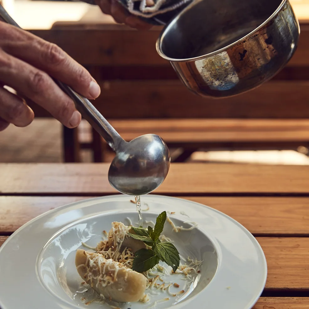 Pasta being finished at the table in Scarpetta’s own photography